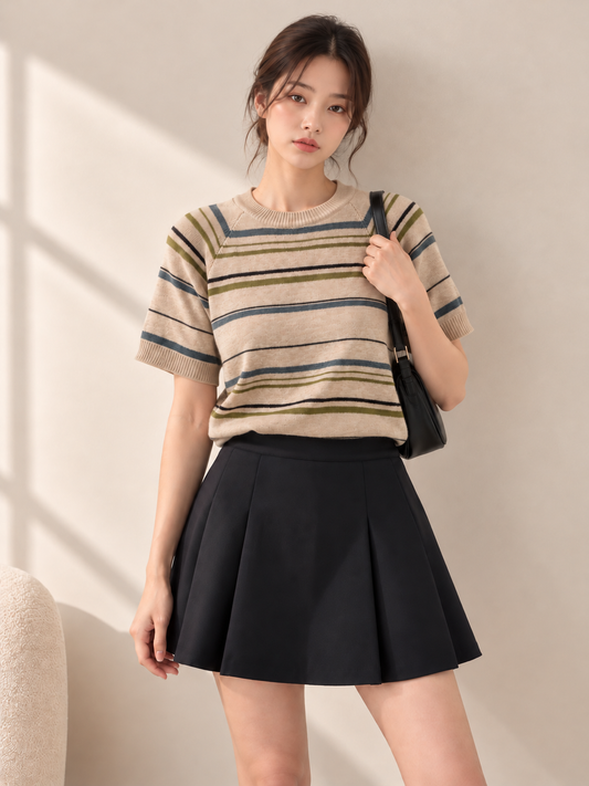 Beige striped short sleeve knit top on model, front view