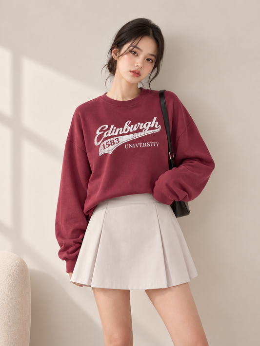 Burgundy Edinburgh sweatshirt styled with ivory skirt